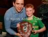 Aaron McHenry from Central Restaurant Ballycastle presenting Cuchullains Dunloy team captain Damien McMahan with the Central Restaurant U8 Indoor Hurling Division 2 Shield